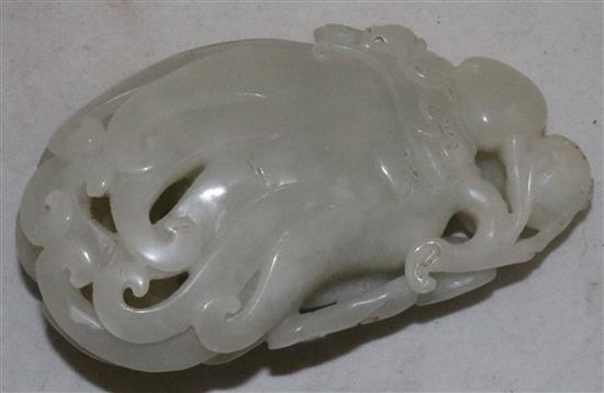 A Chinese white jade carving of a finger citron, lingzhi fungus and fruit sprigs, 19th/20th century, 10.5cm